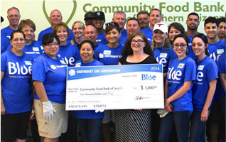 Employee holding a check 